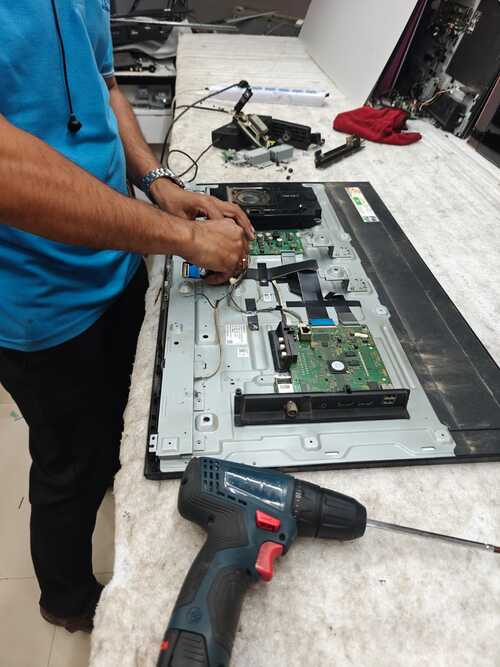 tv techician is busing inrepairing tv