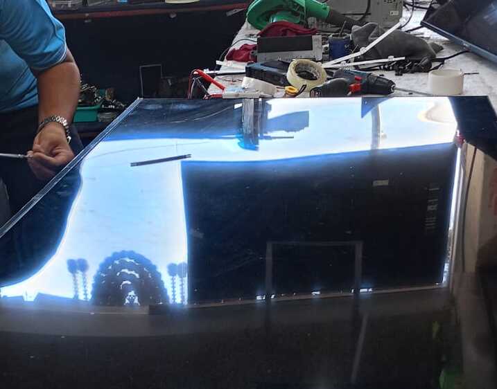 Technician repairing Samsung Smart TV at customer's home in Pimpri Chinchwad, Pune